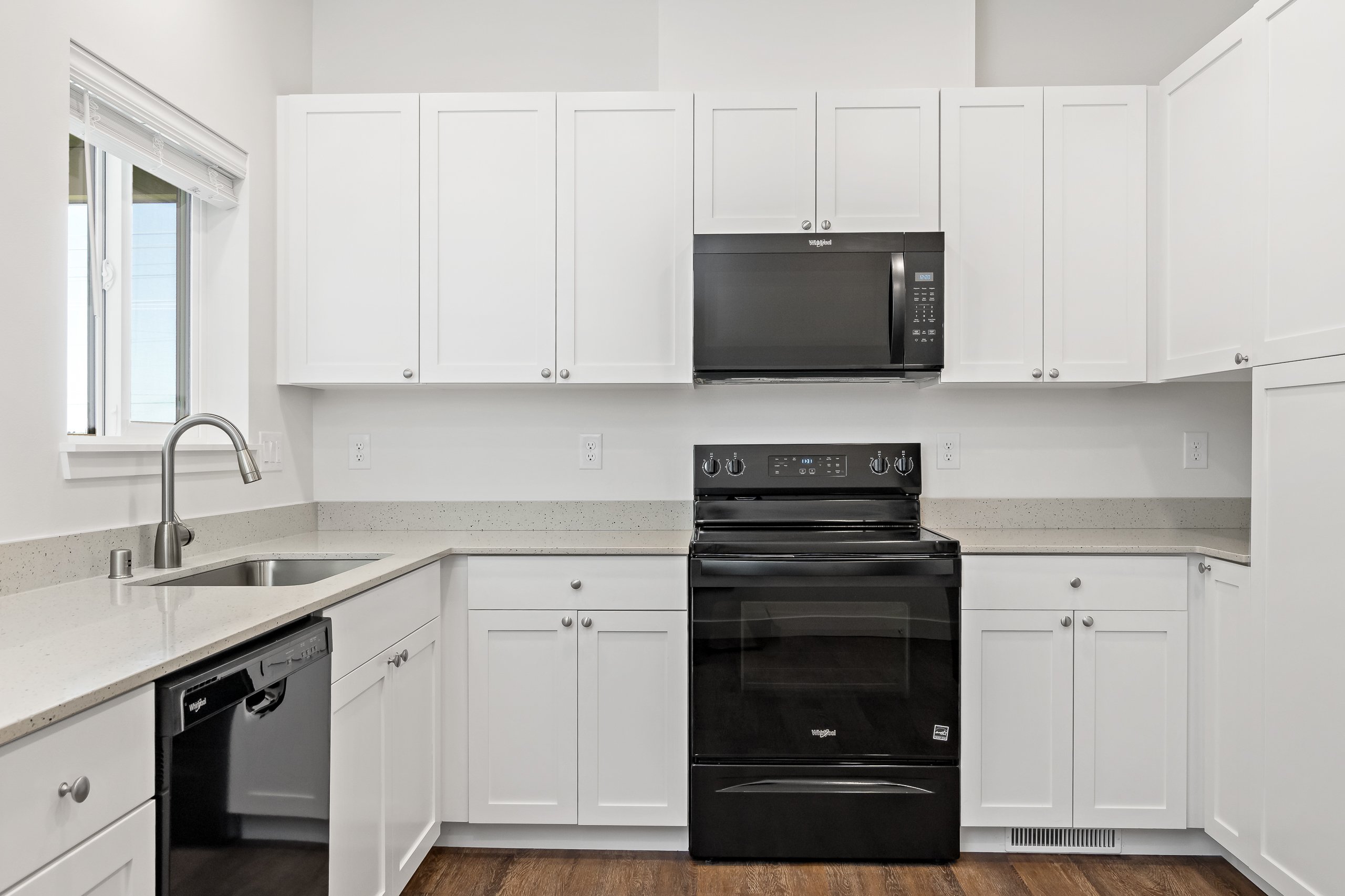 Kitchen with Quartz Countertop and Shaker Cabinets