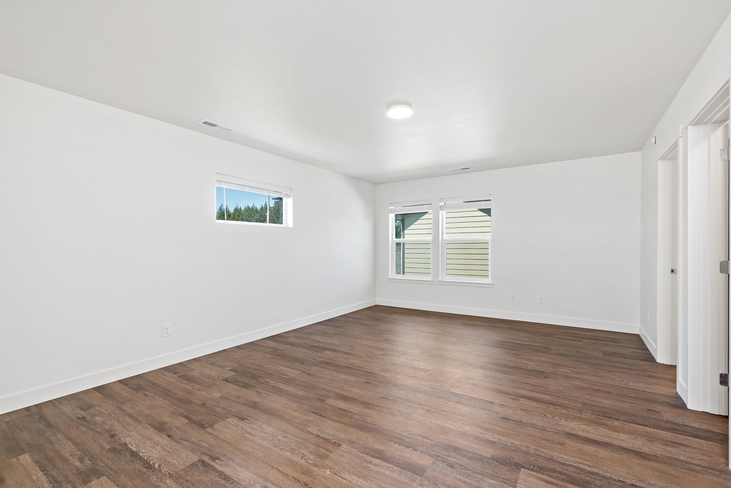 Primary Bedroom with LVP Flooring